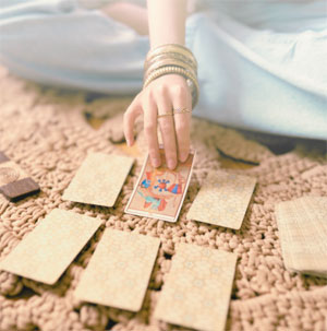 woman with tarot cards